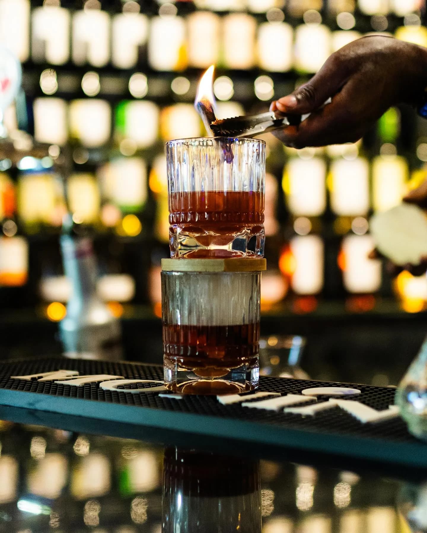 A bartender building a drink at the Kultura bar