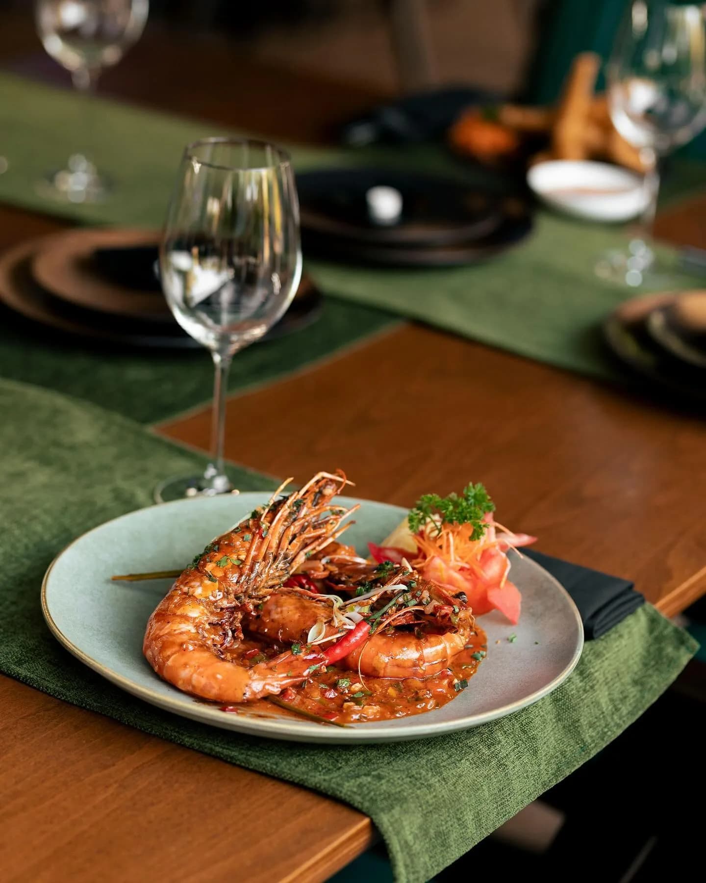 Chilli garlic prawns, head on, plated at Kultura