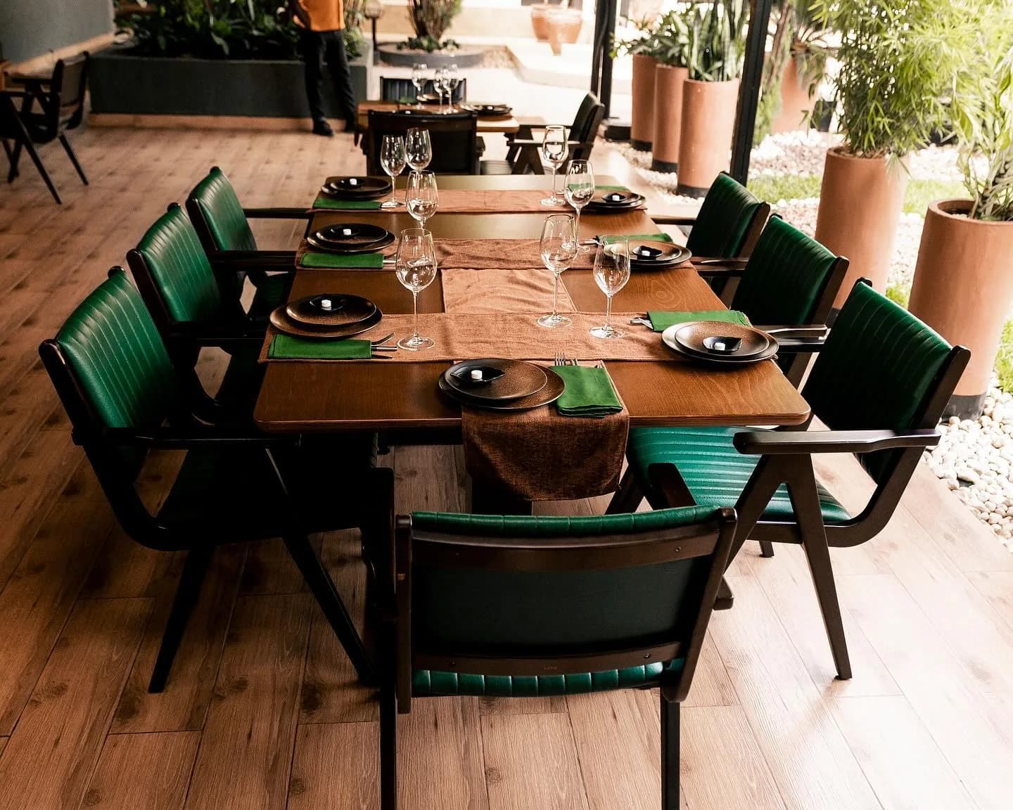 The terrace at Kultura set with green chairs
