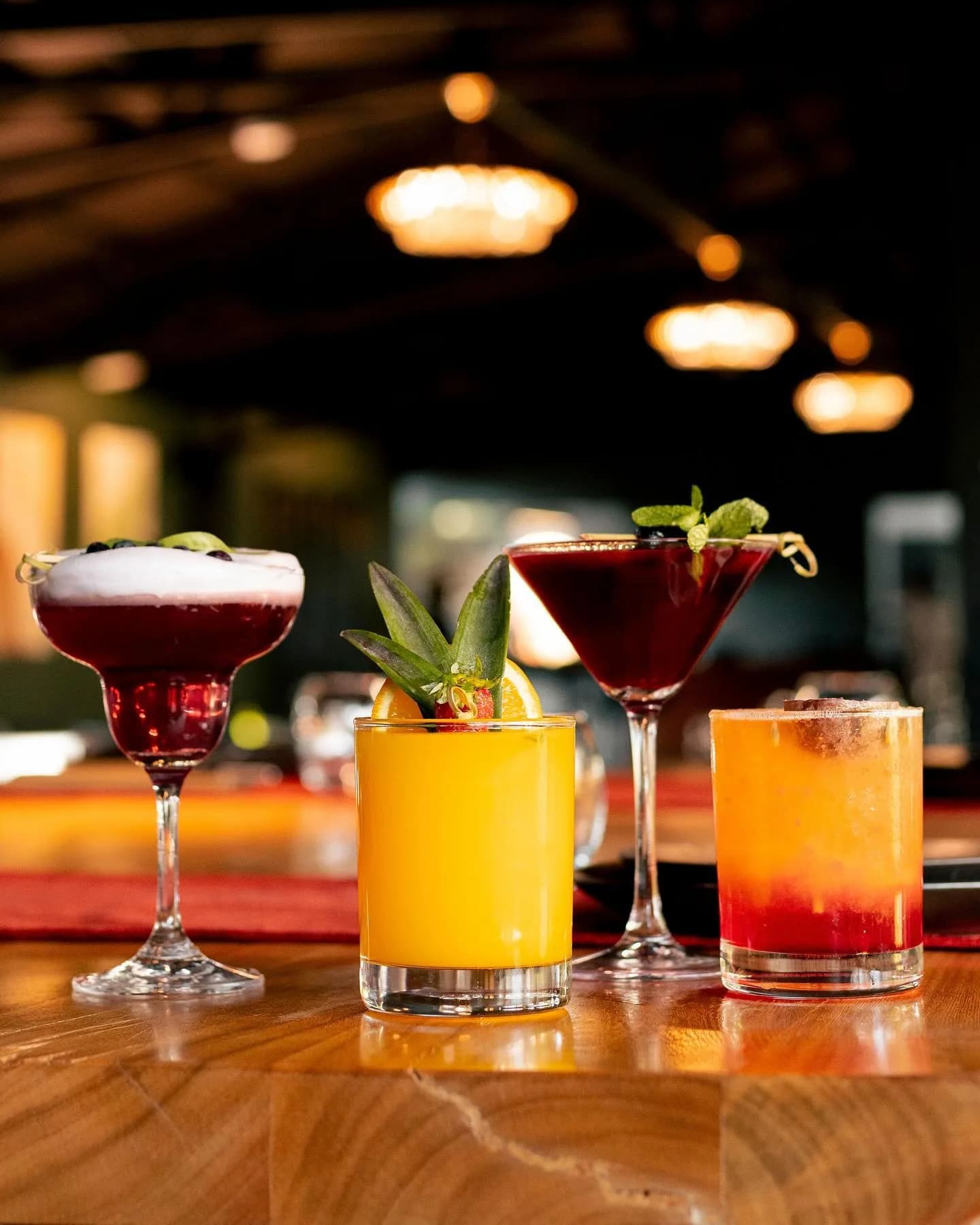 Three signature cocktails lined up at Kultura